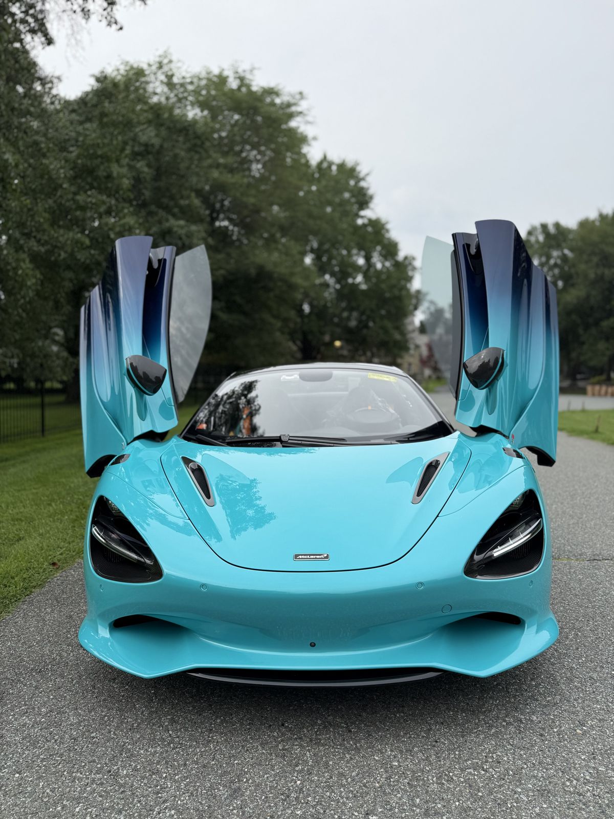 Turquoise McLaren 750S with doors open