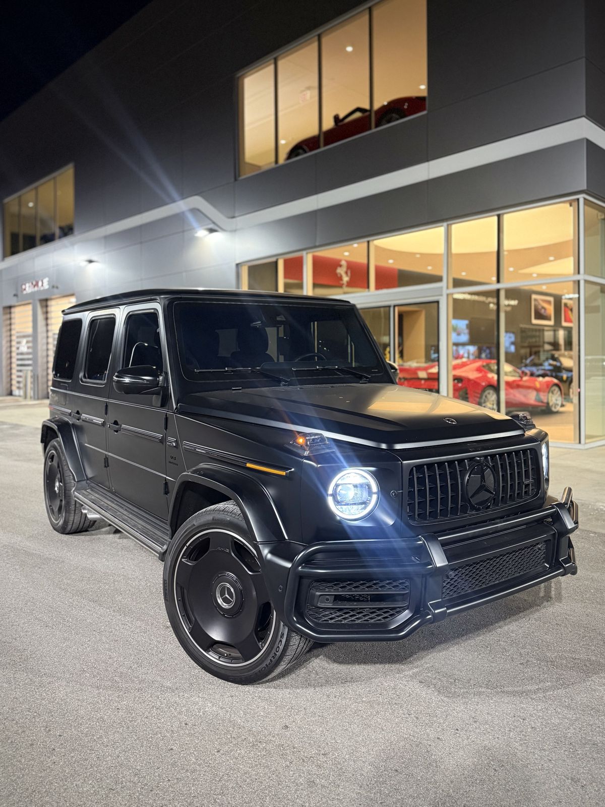 Matte black Mercedes-AMG G63 at night
