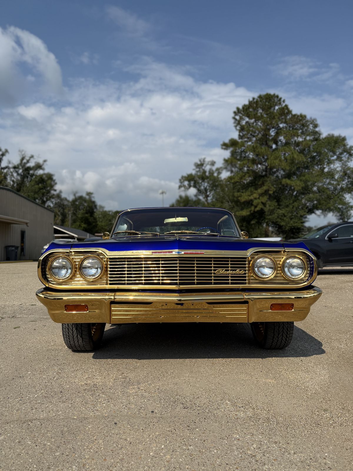 Blue lowrider Chevrolet Impala with gold trim